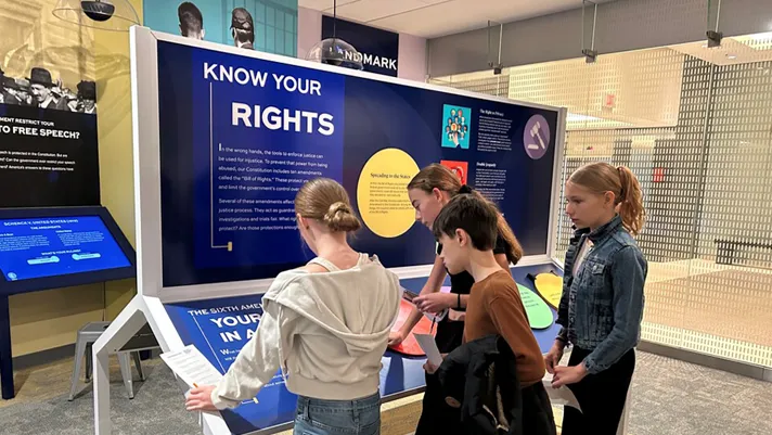 Students interact with exhibits at the new learning center in St. Paul, Minnesota.